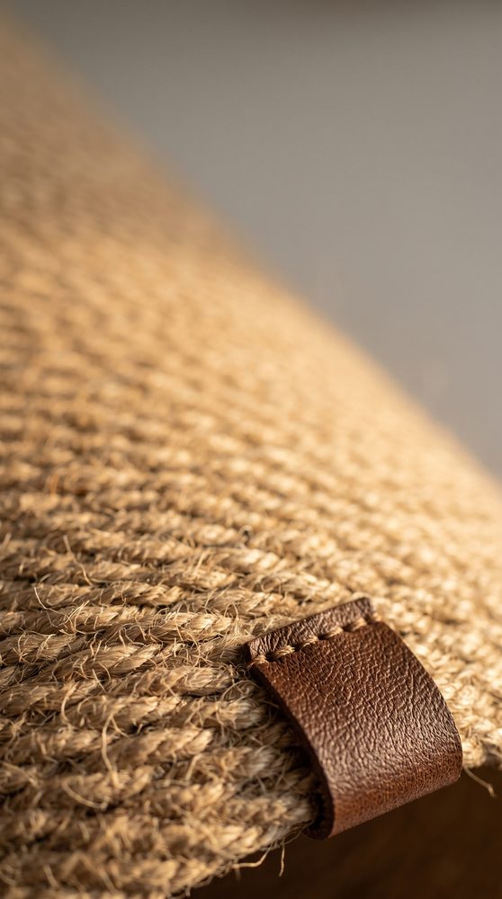 Close up of the jute rope weave and the stitched leather tag